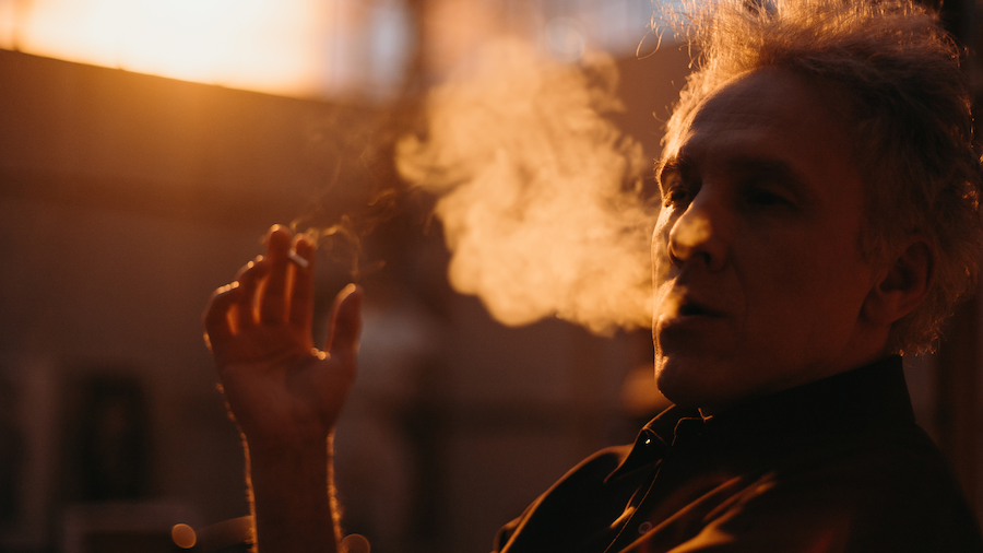 An old Macedonia man smoking a cigarette inside one of many of Skopje's kafanas.