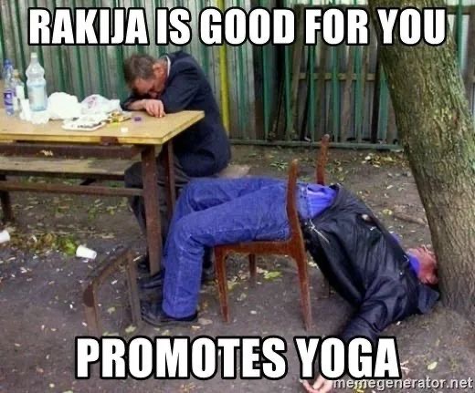 Two older Balkan gentleman clearly drunk drinking Rakija in a park.